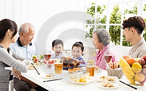 Asian family having dinnerÂ at home